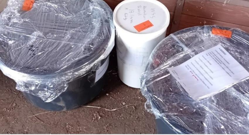 Nutrient mixtures and biochar being transported to the farm to await